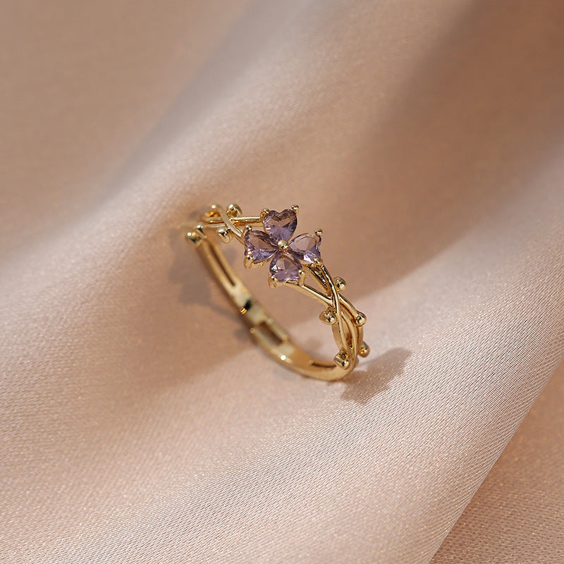 Signature GetUp Elegant Crystal Flower Gold Ring – French Retro Shiny Purple Zircon Four-Petal Design for Women