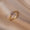 Signature GetUp Elegant Crystal Flower Gold Ring – French Retro Shiny Purple Zircon Four-Petal Design for Women